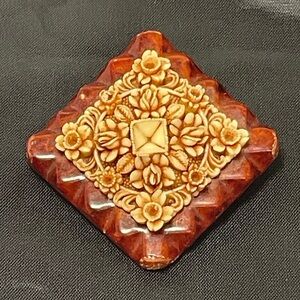 Vintage carved celluloid and wood broach. Rare find!